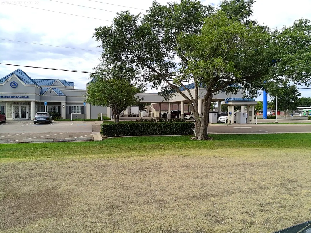 Front of the Amarillo National Bank Southeast Branch behind shade trees
