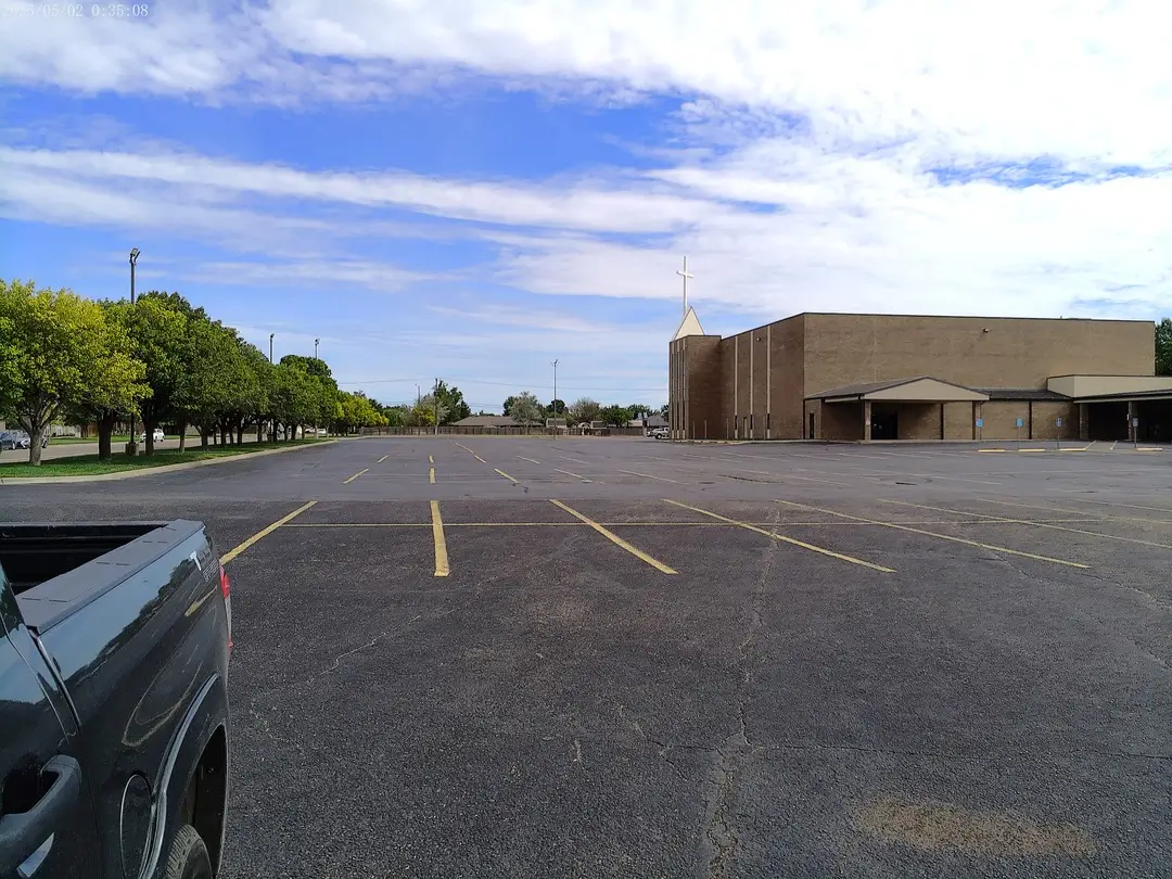 Arden Road Baptist Church building and paved parking lot