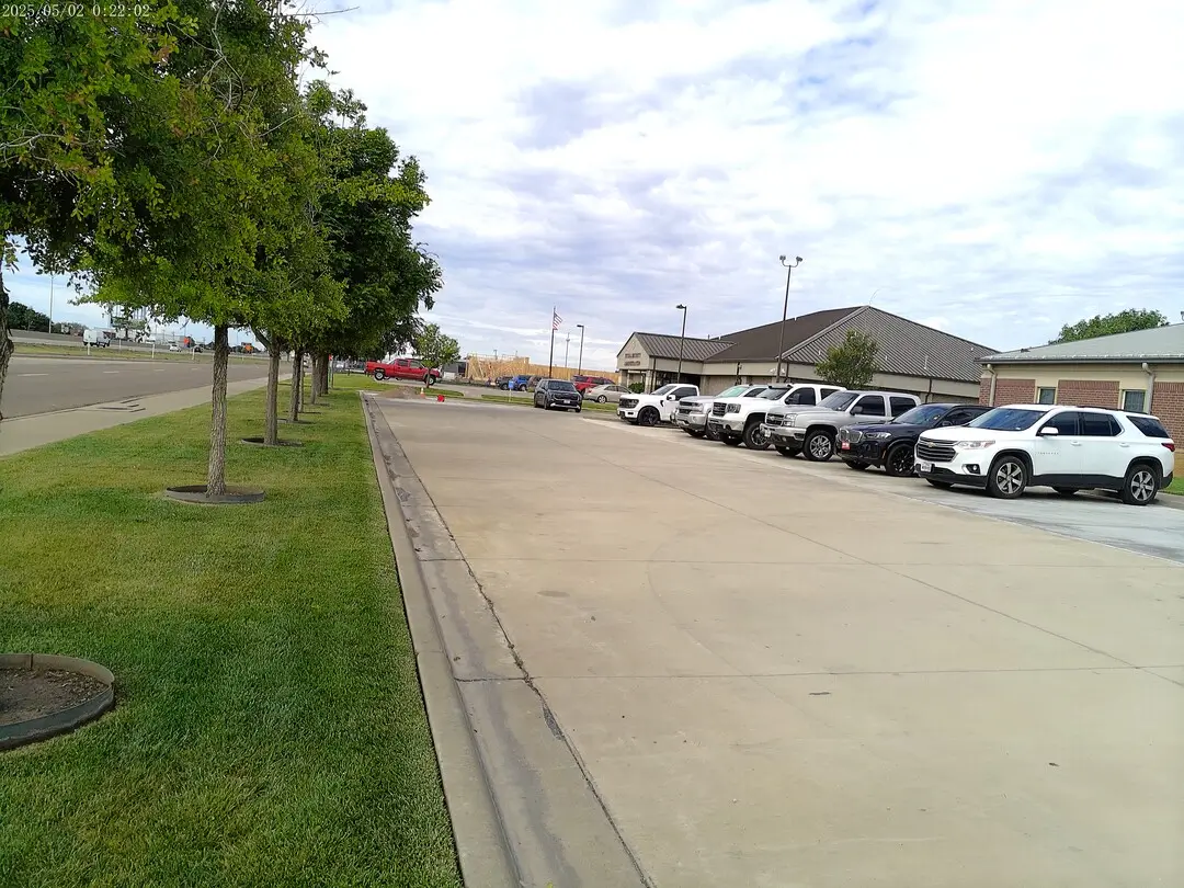 Atmos Energy facility with fleet trucks parked along the building