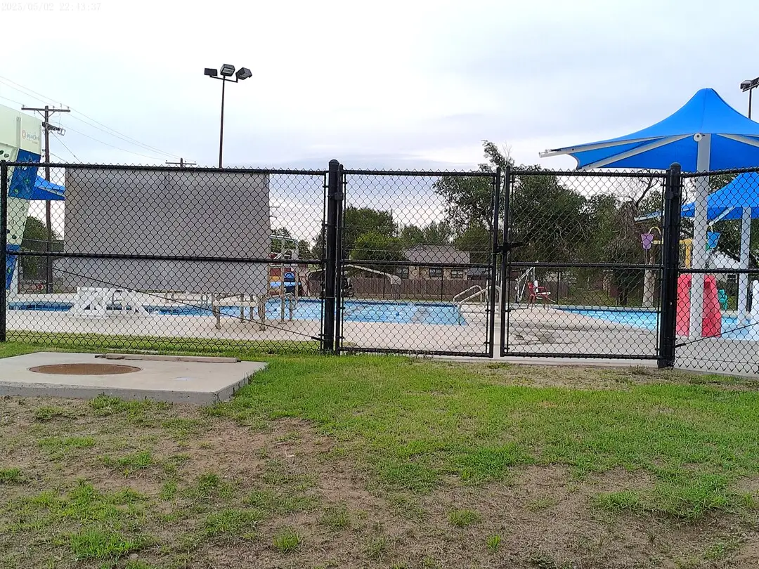 Pool and blue shade canopies at the Clarendon Outdoor Aquatic Center
