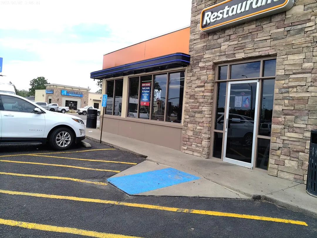 Dairy Queen entrance with stone columns and storefront glass