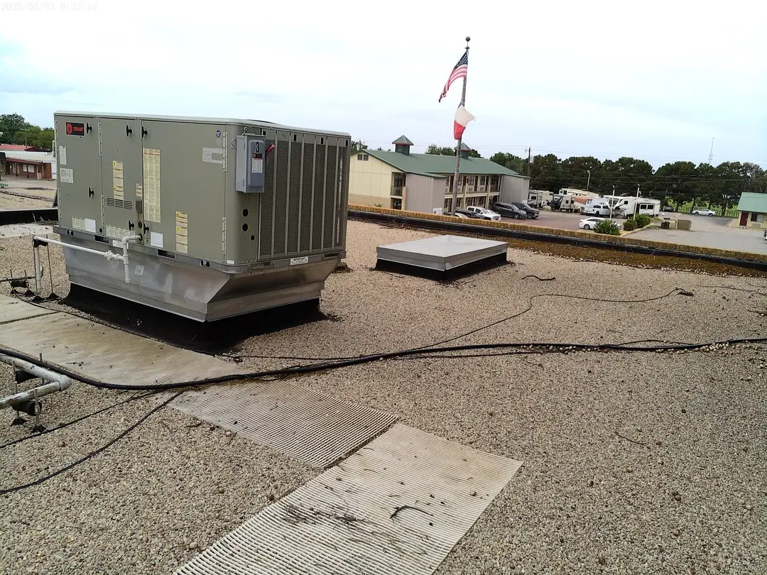 Packaged HVAC unit on the gravel roof of the DPS building in Childress