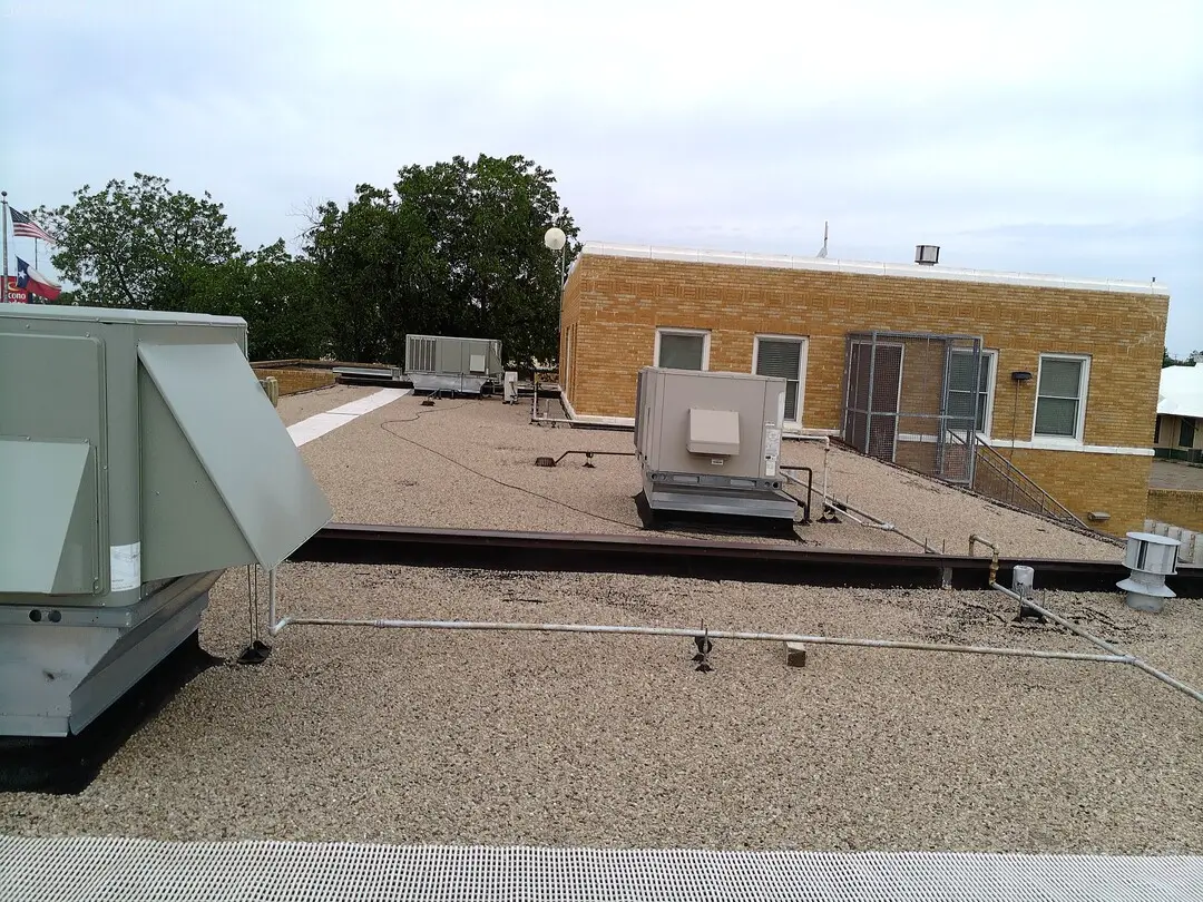 Rooftop unit and ductwork beside the upper level of the DPS building